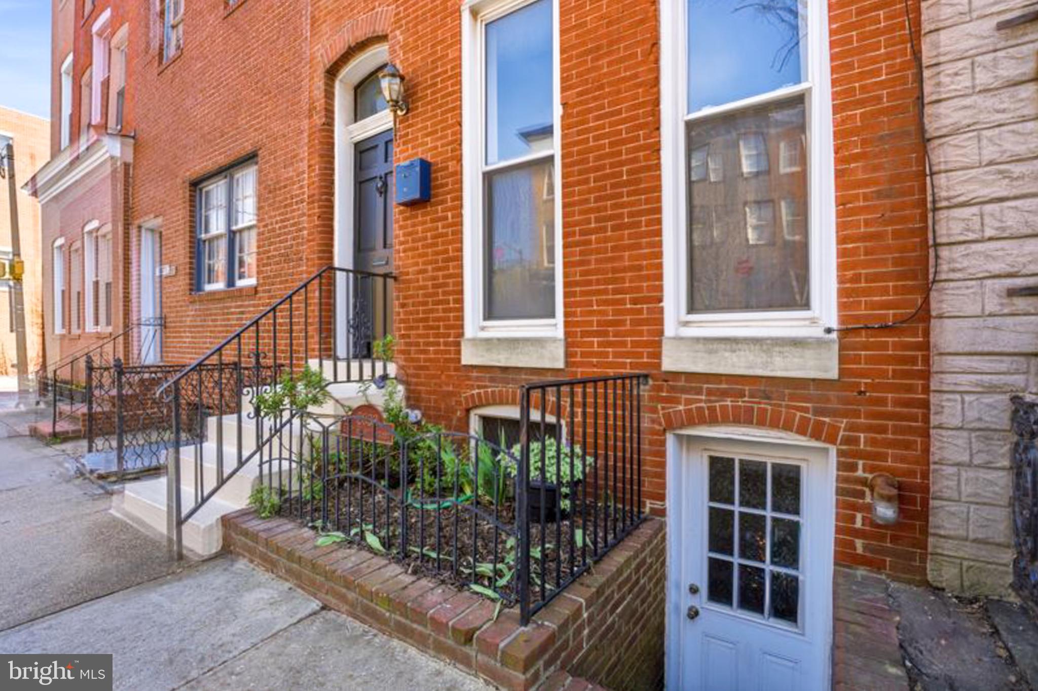 2033 East Pratt Street Baltimore, MD 21231 - Photo 6 of 61 a view of a brick building with many windows