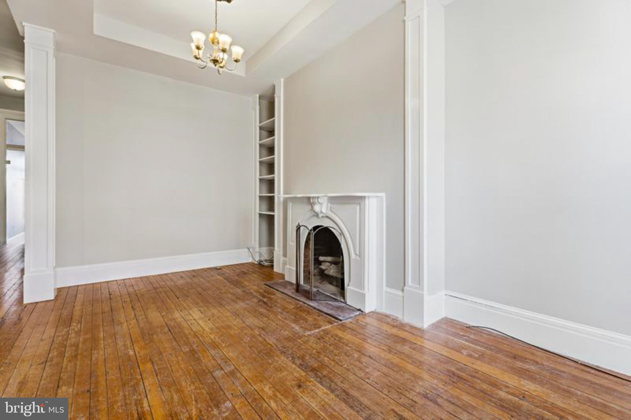 2033 East Pratt Street Baltimore, MD 21231 - Photo 8 of 61 a view of livingroom with window fireplace