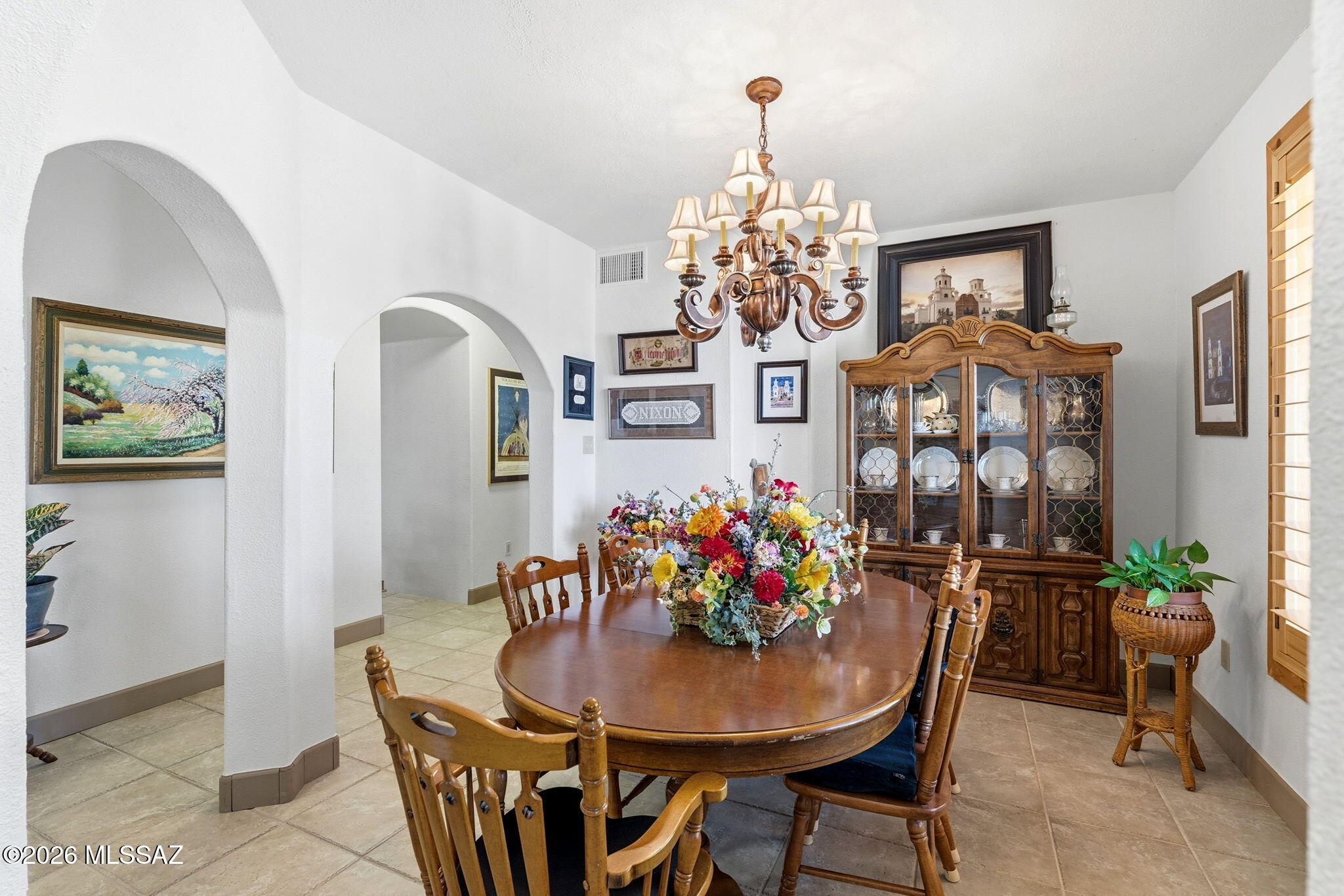 12810 West Gunsmoke Road Tucson, AZ 85736 - Photo 8 of 51 a view of a dining room with furniture and chandelier