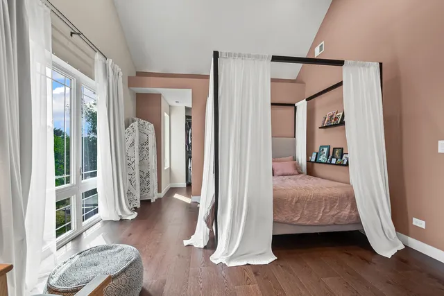 a living room with furniture and a walk in closet