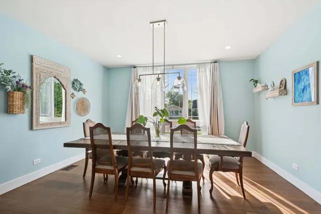a view of a dining room with furniture window and outside view