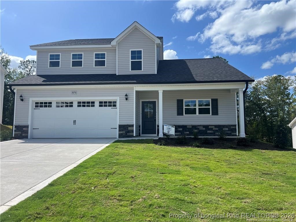 a view of a house with a yard