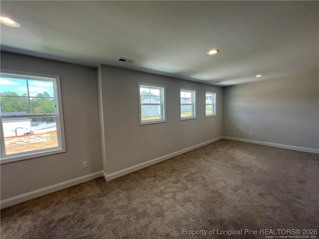 3870 Blackhills Road Fayetteville, NC 28311 - Photo 13 of 22 a view of an empty room with windows
