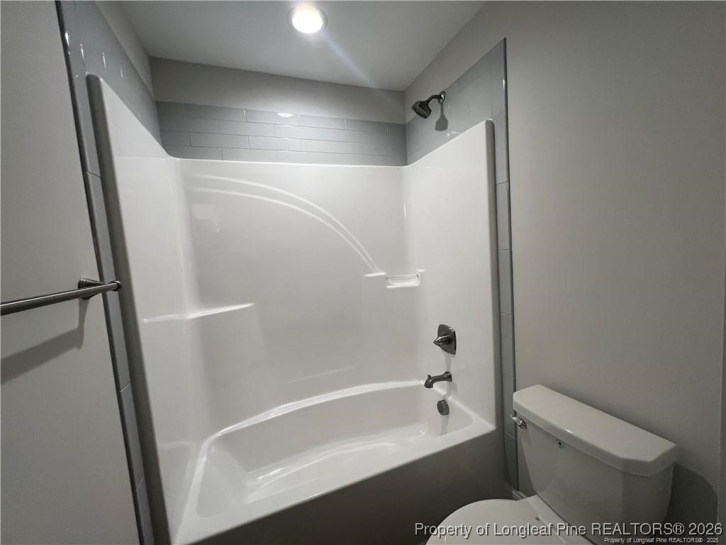 3870 Blackhills Road Fayetteville, NC 28311 - Photo 15 of 22 a bathroom with a bathtub toilet and a shower