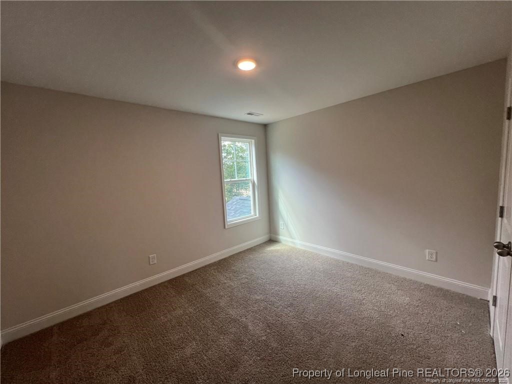 3870 Blackhills Road Fayetteville, NC 28311 - Photo 18 of 22 an empty room with windows