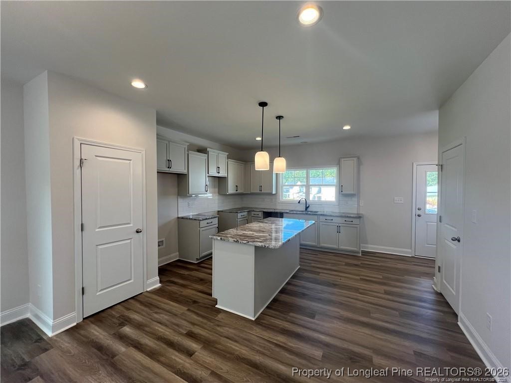 3870 Blackhills Road Fayetteville, NC 28311 - Photo 2 of 22 a kitchen with a sink and a stove top oven