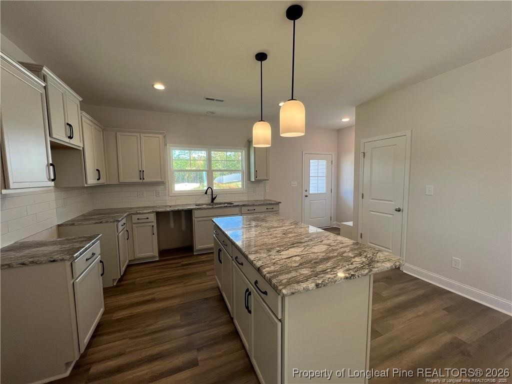3870 Blackhills Road Fayetteville, NC 28311 - Photo 3 of 22 a kitchen with a stove and a sink