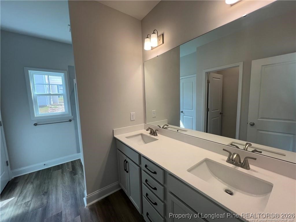 3870 Blackhills Road Fayetteville, NC 28311 - Photo 9 of 22 a bathroom with a sink double vanity granite and a mirror