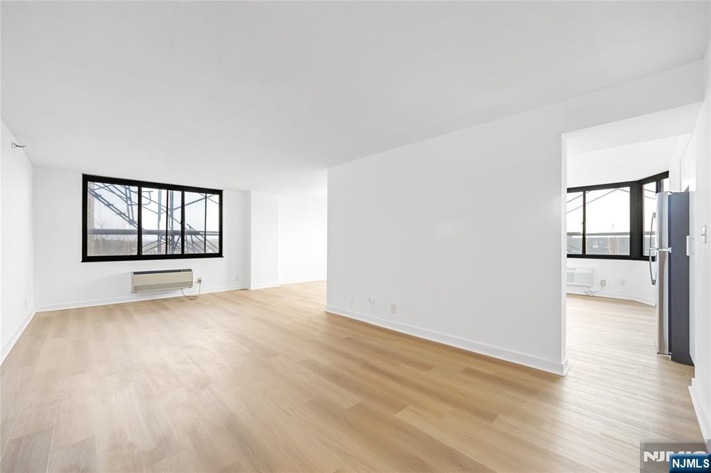 316 Prospect Avenue, Unit 4E Hackensack, NJ 07601 - Photo 15 of 19 wooden floor in an empty room with a window