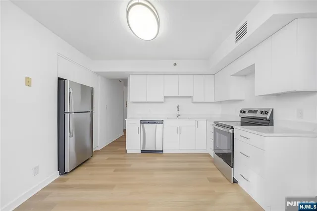 a view of a kitchen with a sink