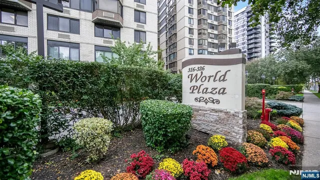 a sign that is in front of flowers