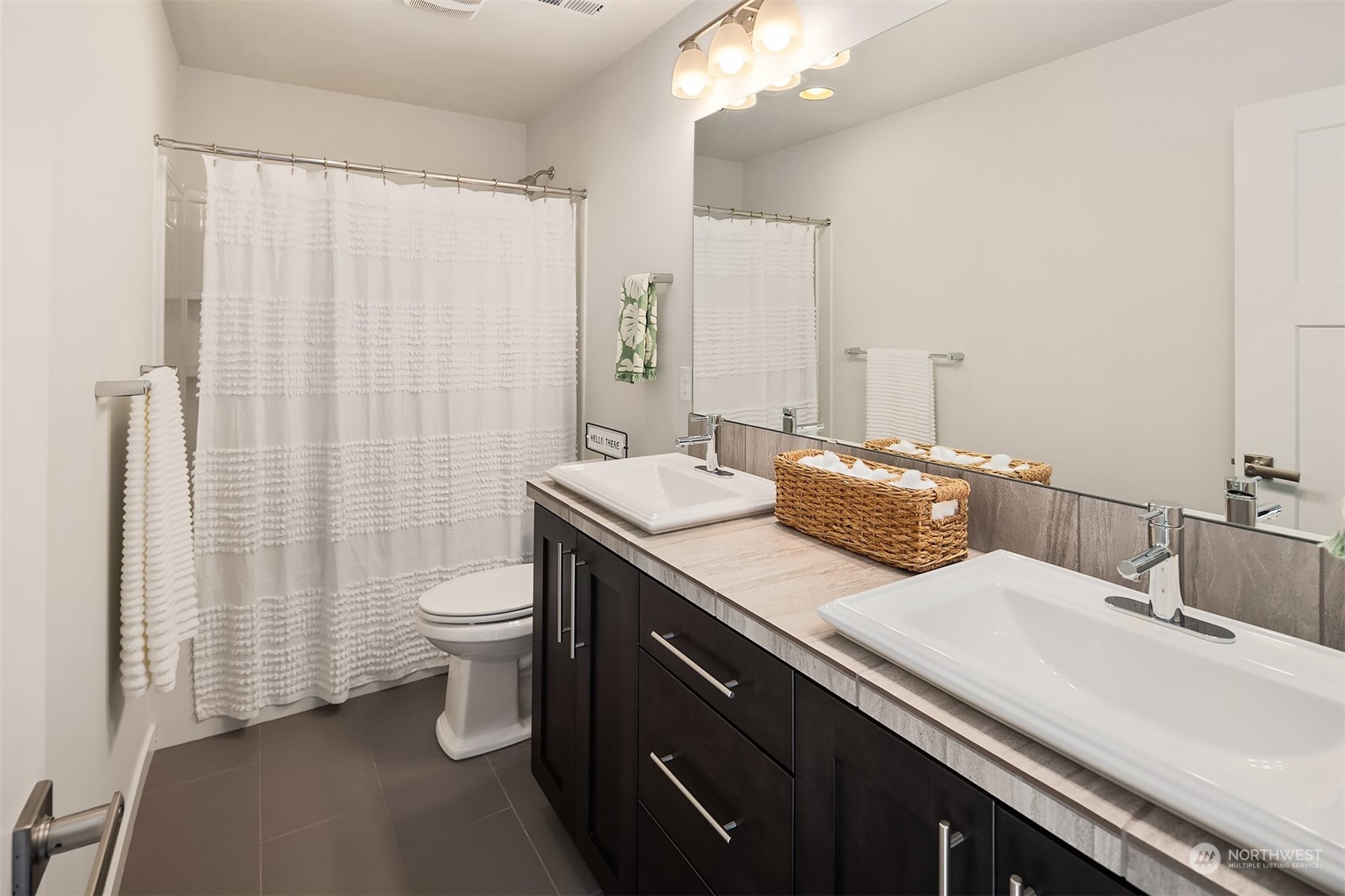 22607 42nd Drive Southeast Bothell, WA 98021 - Photo 17 of 26 a bathroom with a double vanity sink toilet and shower