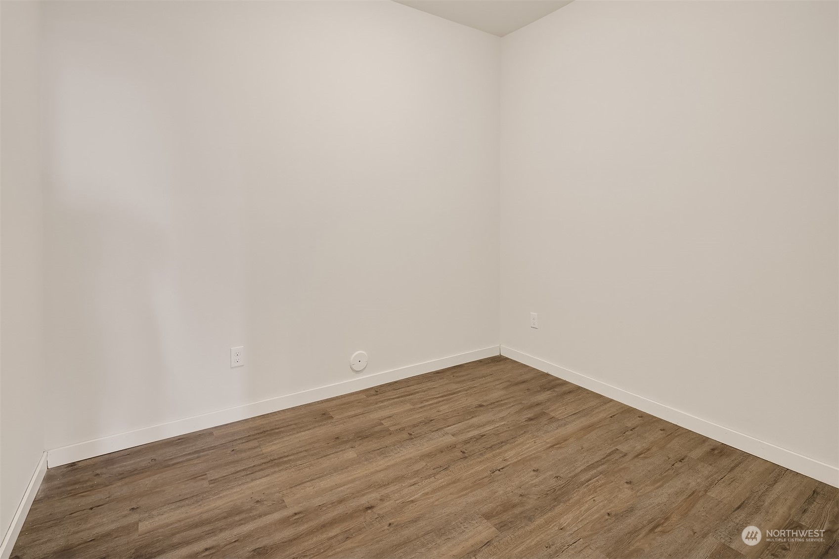 22607 42nd Drive Southeast Bothell, WA 98021 - Photo 19 of 26 a view of an empty room with wooden floor