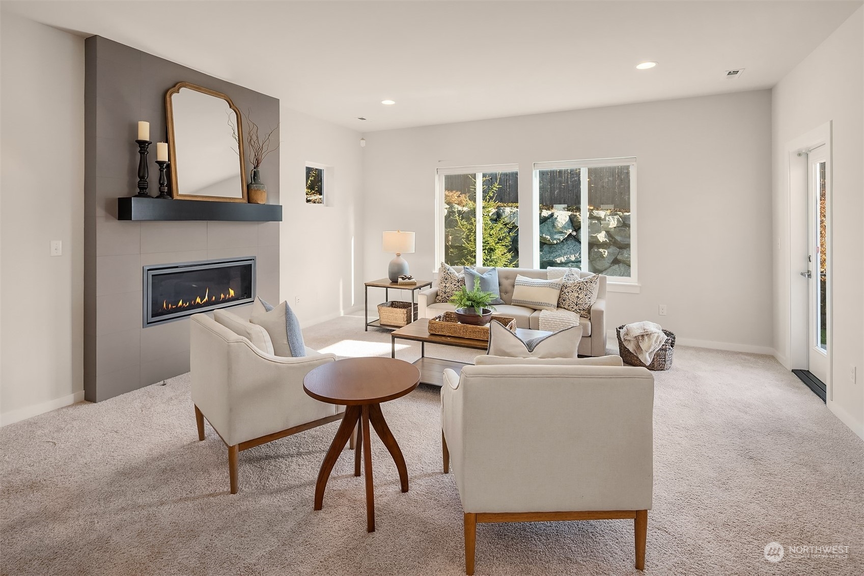 22607 42nd Drive Southeast Bothell, WA 98021 - Photo 3 of 26 a living room with furniture a fireplace and a large window