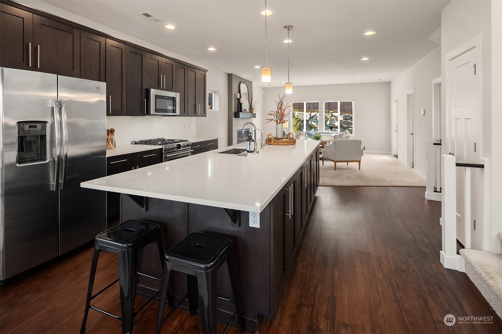22607 42nd Drive Southeast Bothell, WA 98021 - Photo 10 of 26 a large kitchen with a table chairs refrigerator and microwave