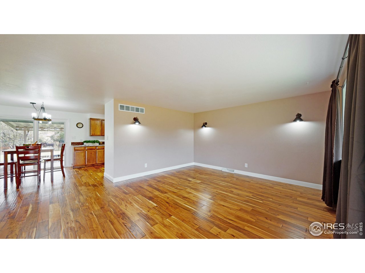 3324 Terry Lake Road Fort Collins, CO 80524 - Photo 6 of 40 Living Room Looking Into Dining Room