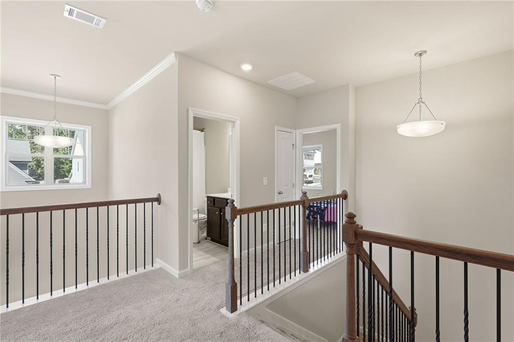 3247 Hawthorne Path Braselton, GA 30517 - Photo 32 of 44 a view of hallway with bedroom
