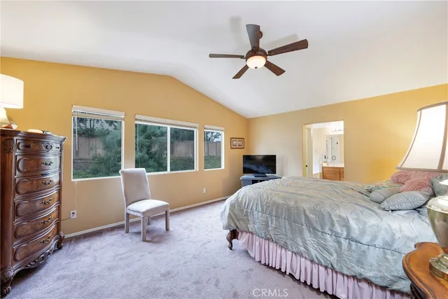 a bathroom with a tub a double vanity sink a mirror and a shower
