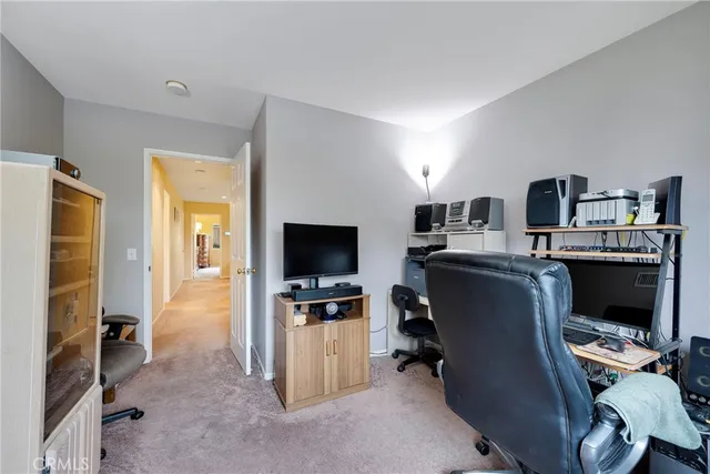 a view of a patio with table and chairs with wooden floor and fence
