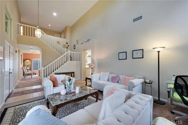 a living room with furniture or couch and a dining table