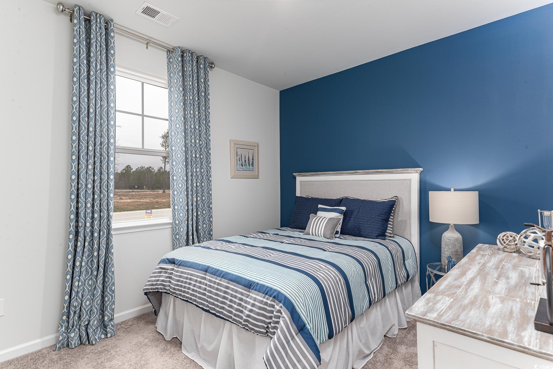 1029 St Martin Street Georgetown, SC 29440 - Photo 14 of 23 Bedroom with light carpet and baseboards