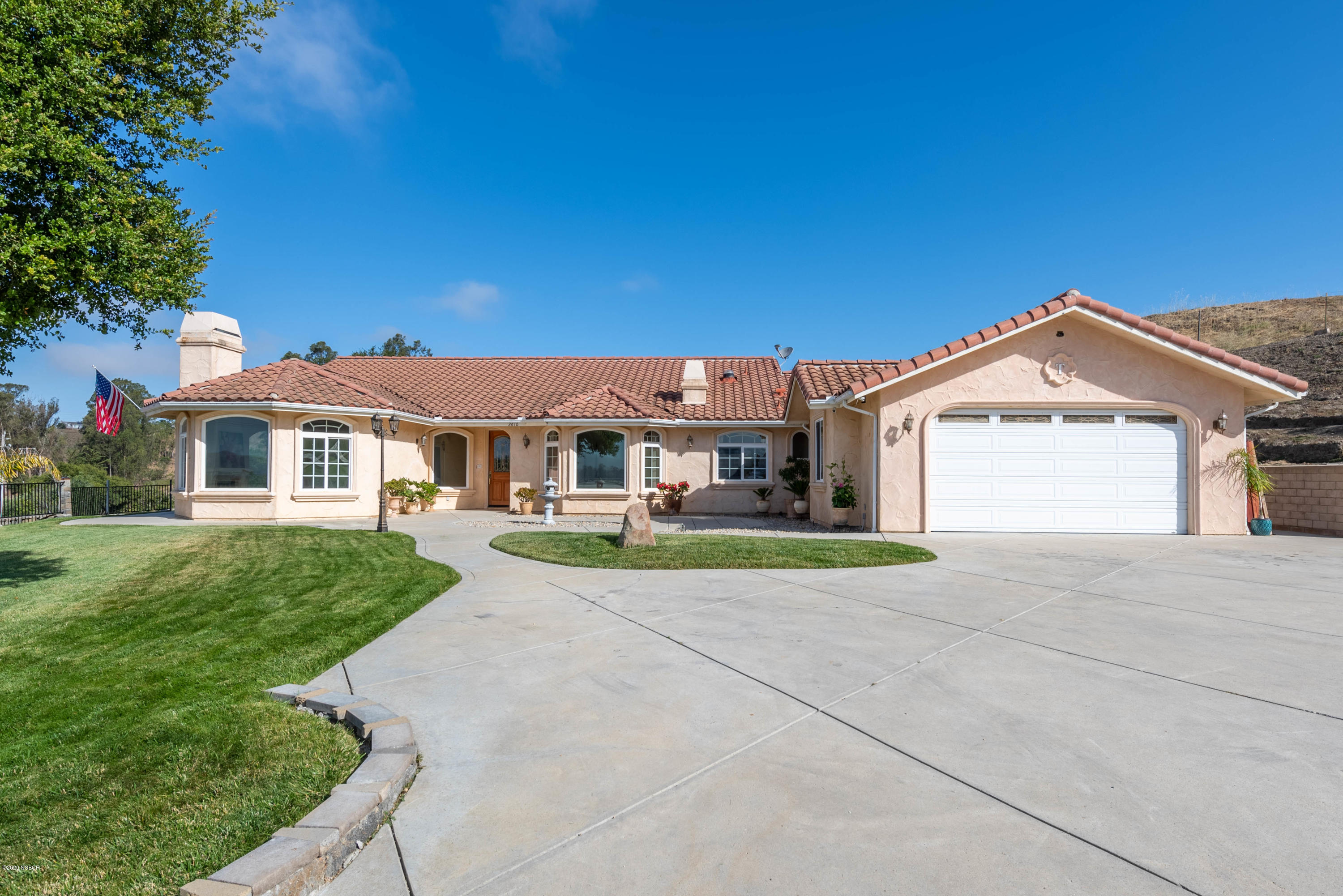 2610 Le Valley Road Lompoc, CA 93436 - Photo 1 of 36 a view of house with garden and tall tress