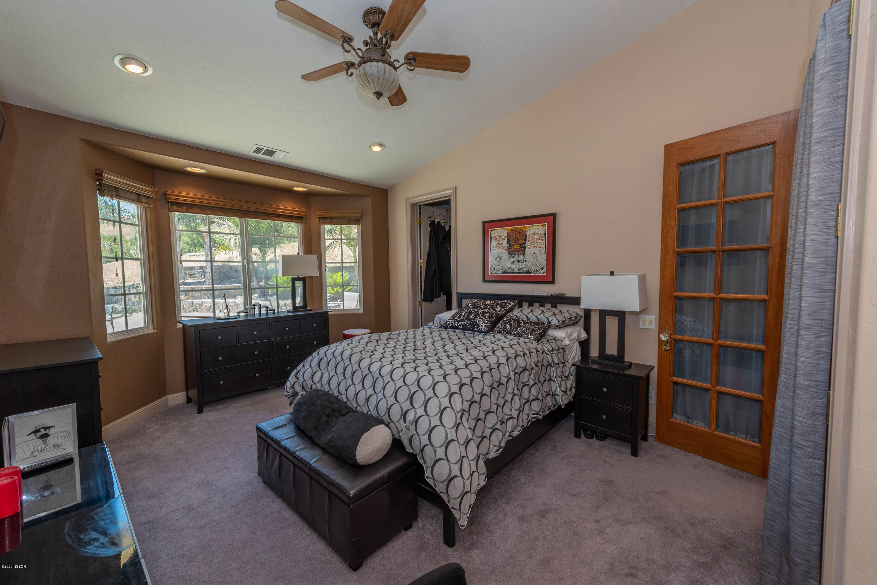 2610 Le Valley Road Lompoc, CA 93436 - Photo 12 of 36 a bedroom with a bed a dresser and a large window