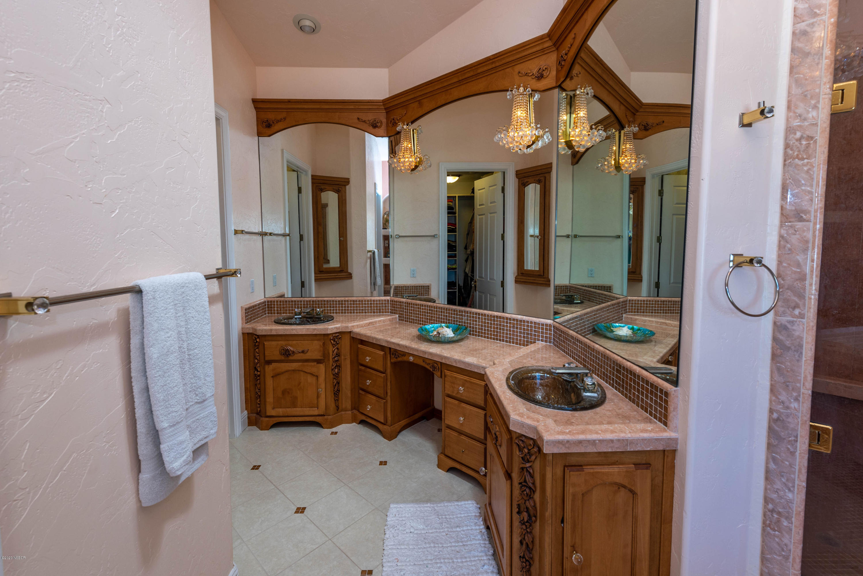 2610 Le Valley Road Lompoc, CA 93436 - Photo 16 of 36 a kitchen that has a sink a stove and a mirror