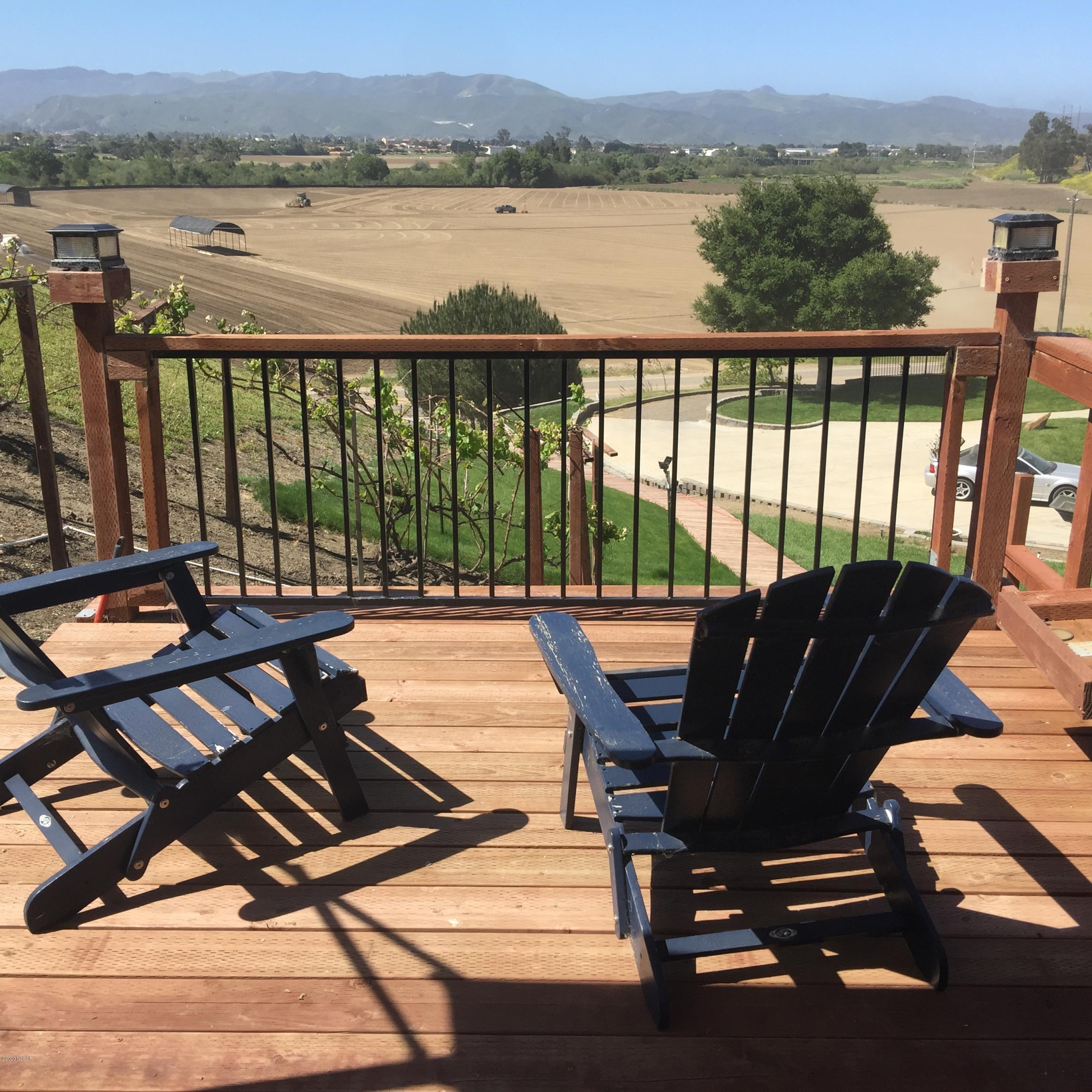 2610 Le Valley Road Lompoc, CA 93436 - Photo 24 of 36 a view of a balcony with chairs and wooden floor