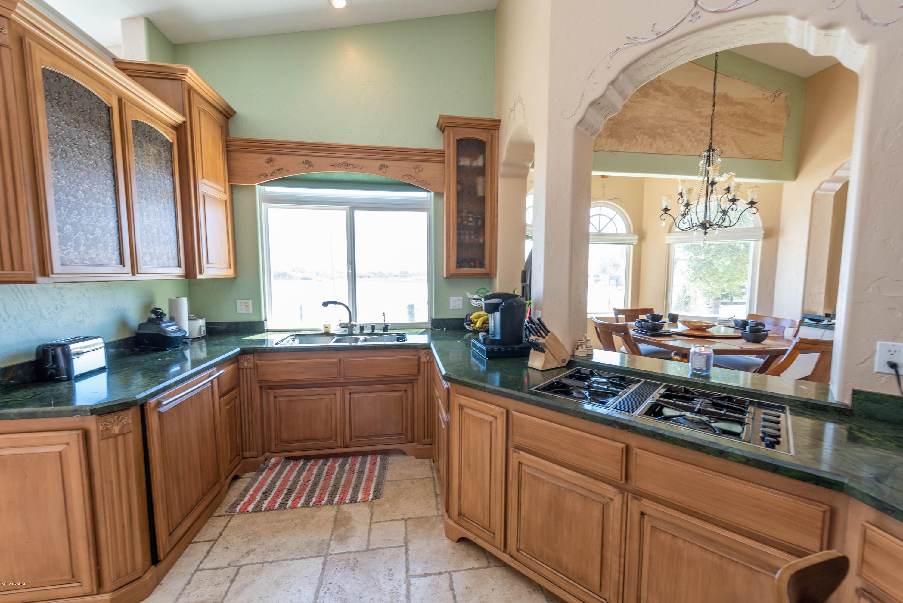 2610 Le Valley Road Lompoc, CA 93436 - Photo 8 of 36 a kitchen with stainless steel appliances granite countertop a sink stove and cabinets