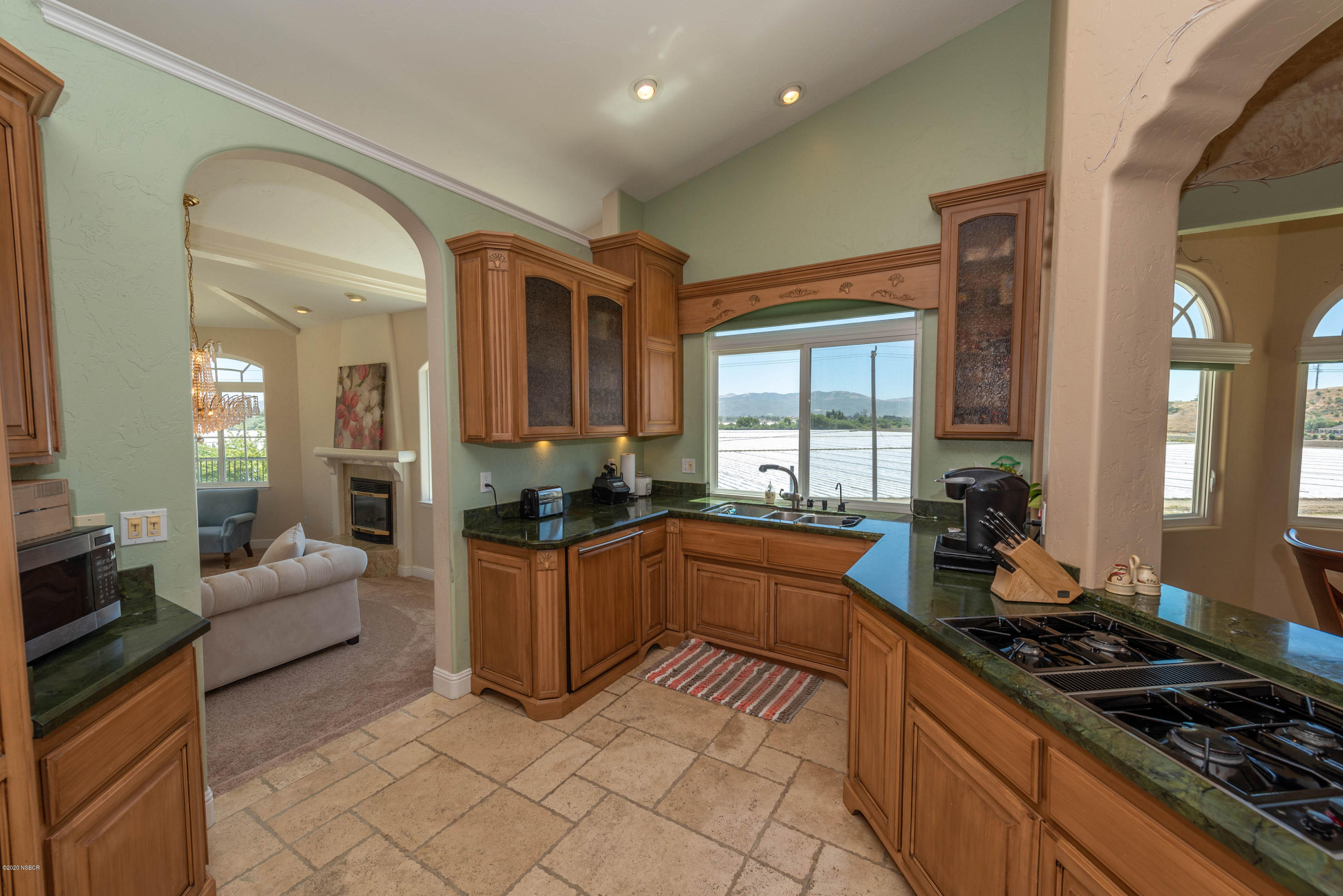 2610 Le Valley Road Lompoc, CA 93436 - Photo 10 of 36 a kitchen with stainless steel appliances granite countertop a stove and a sink