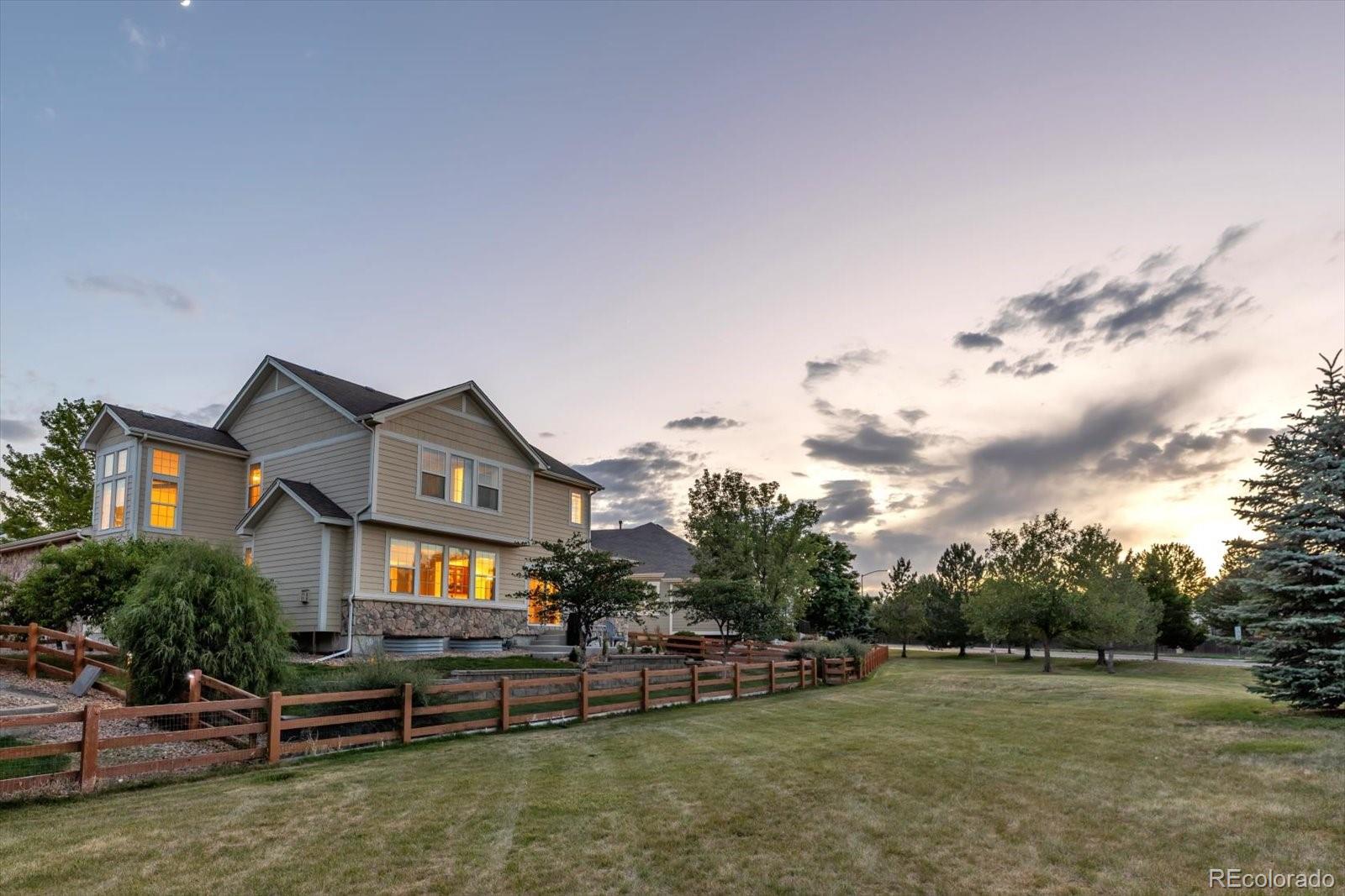 4786 Rabbit Mountain Road Broomfield, CO 80020 - Photo 33 of 41 a front view of a house with a yard