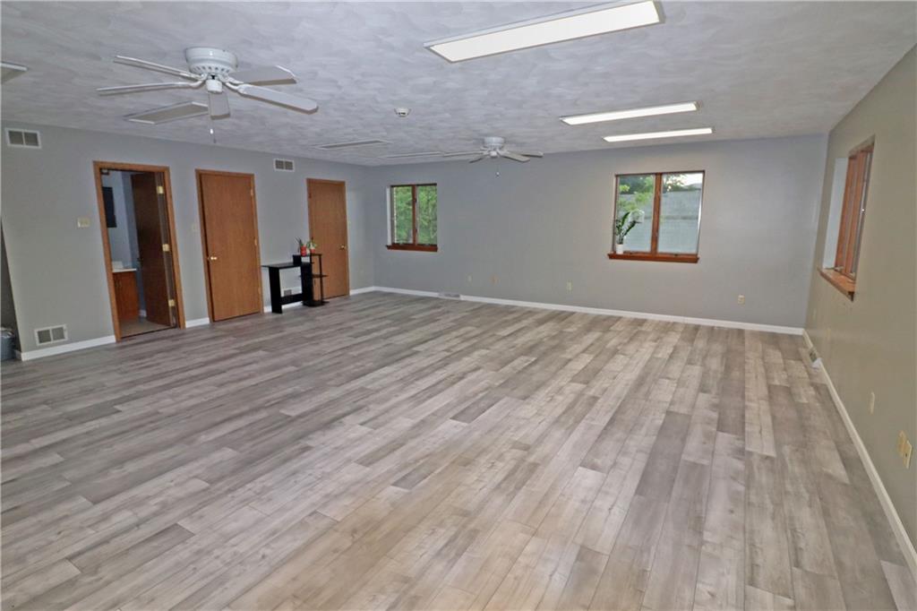 820 South Main Street Greensburg, PA 15601 - Photo 2 of 6 wooden floor in an empty room with a window