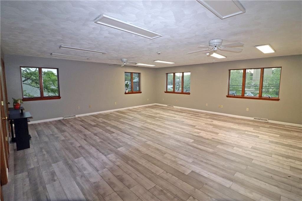 820 South Main Street Greensburg, PA 15601 - Photo 4 of 6 an empty room with wooden floor and windows