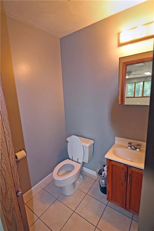 820 South Main Street Greensburg, PA 15601 - Photo 5 of 6 a bathroom with a toilet a sink and a mirror