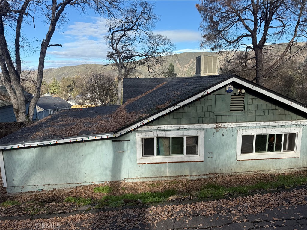 13270 Arrowhead Road Clearlake, CA 95422 - Photo 5 of 11 a front view of a house with a yard