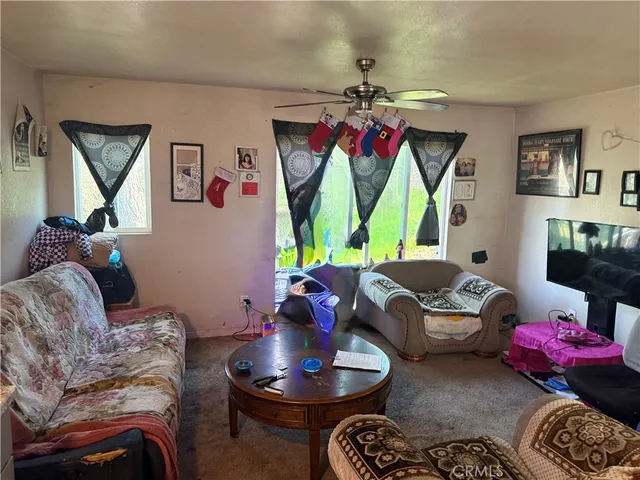 a living room with furniture and a bed