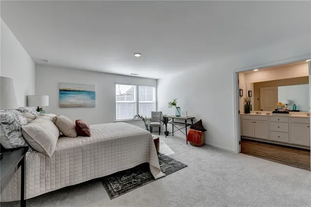 a bedroom with furniture and a window