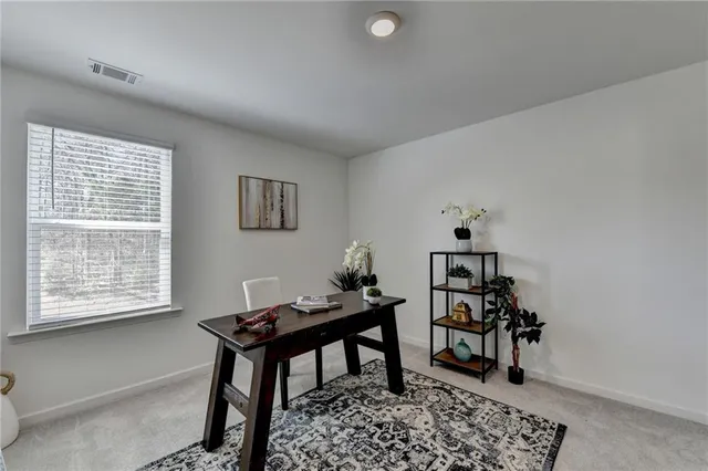 a workspace with furniture and a window