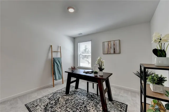 a workspace with furniture and window