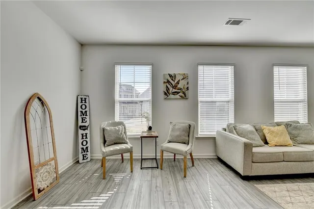 a living room with furniture and a window
