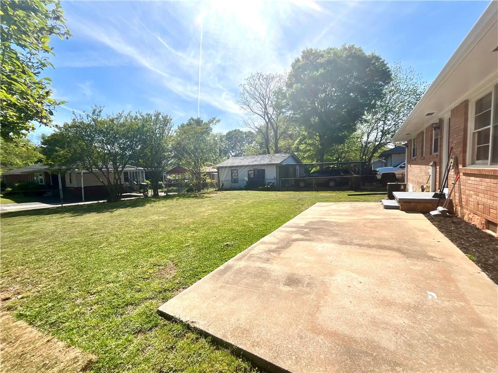 119 Fifth Avenue Jonesboro, GA 30236 - Photo 24 of 29 a view of a swimming pool with a yard