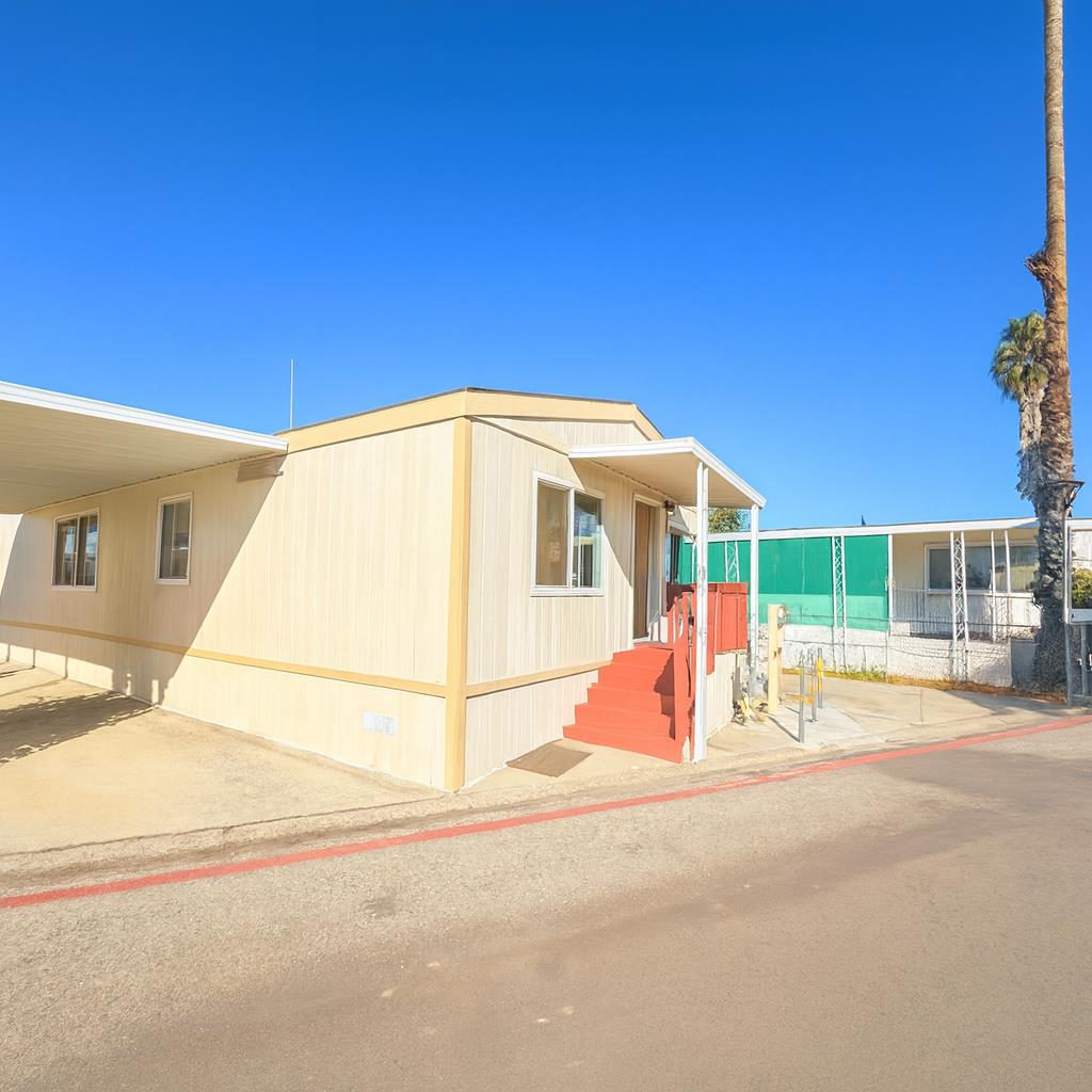 411 Lewis Road, Unit 335 San Jose, CA 95111 - Photo 2 of 27 a view of an house with backyard and road