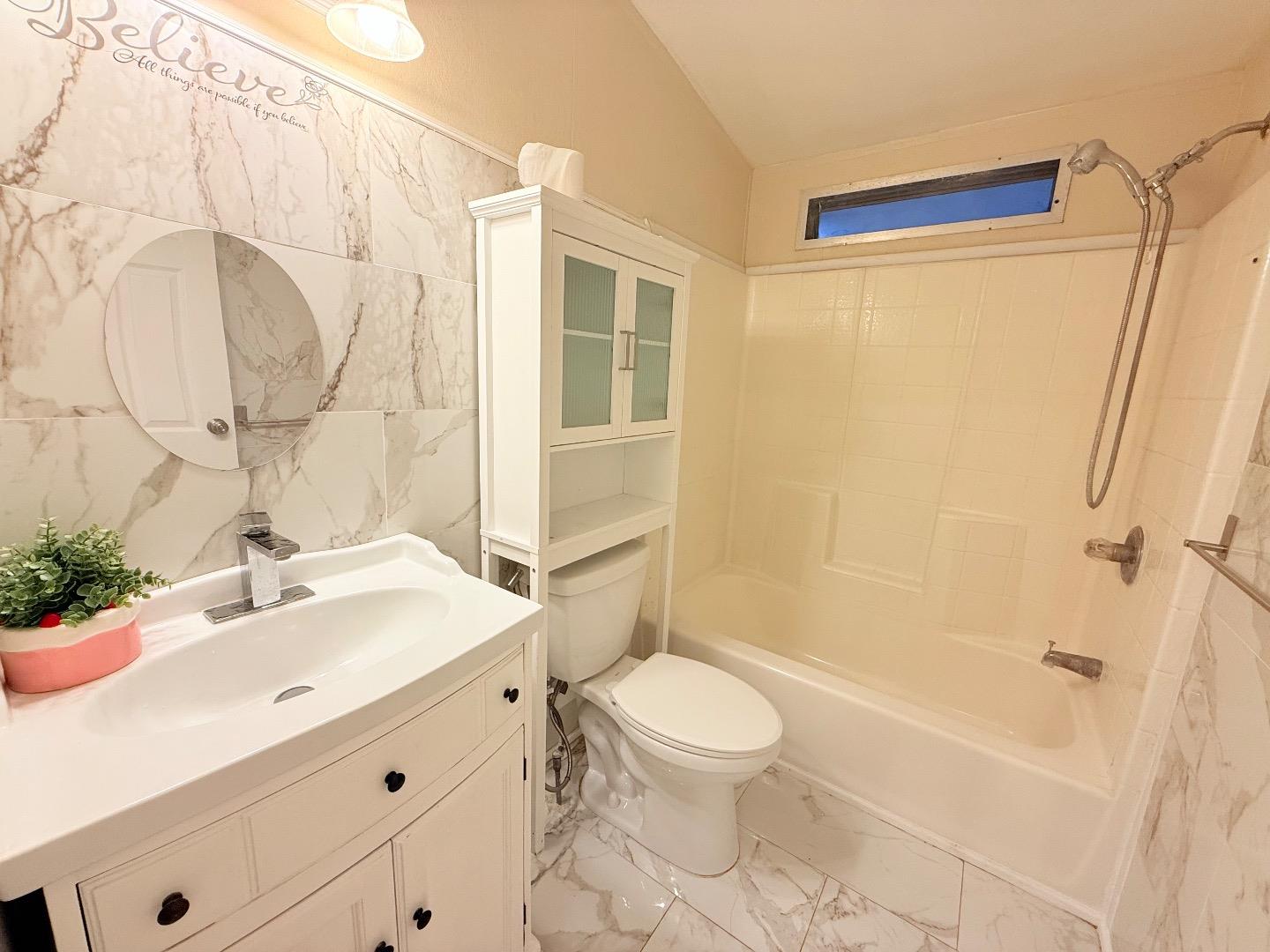 411 Lewis Road, Unit 335 San Jose, CA 95111 - Photo 23 of 27 a bathroom with a sink a toilet and shower