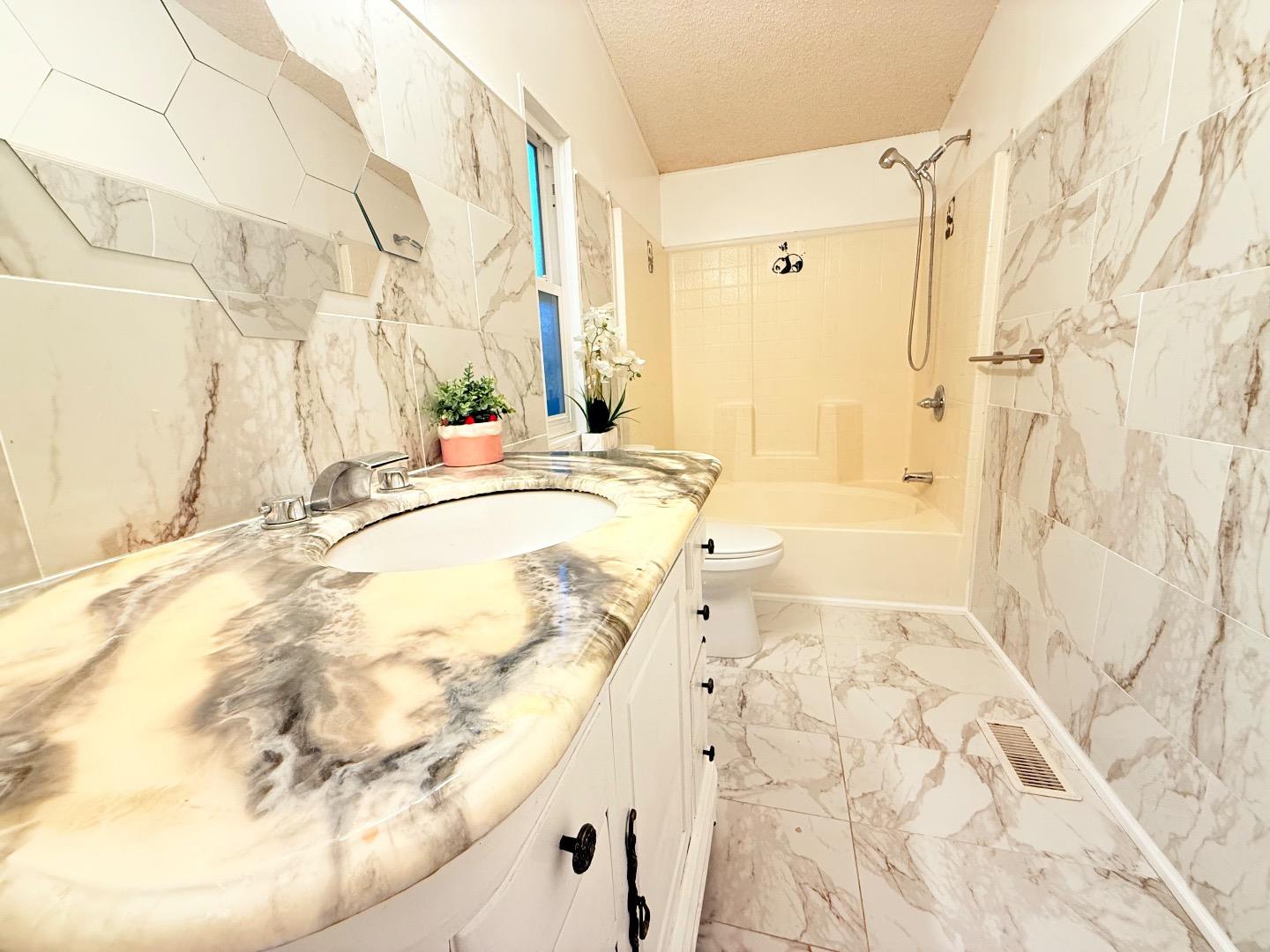 411 Lewis Road, Unit 335 San Jose, CA 95111 - Photo 24 of 27 a bathroom with a bathtub and shower