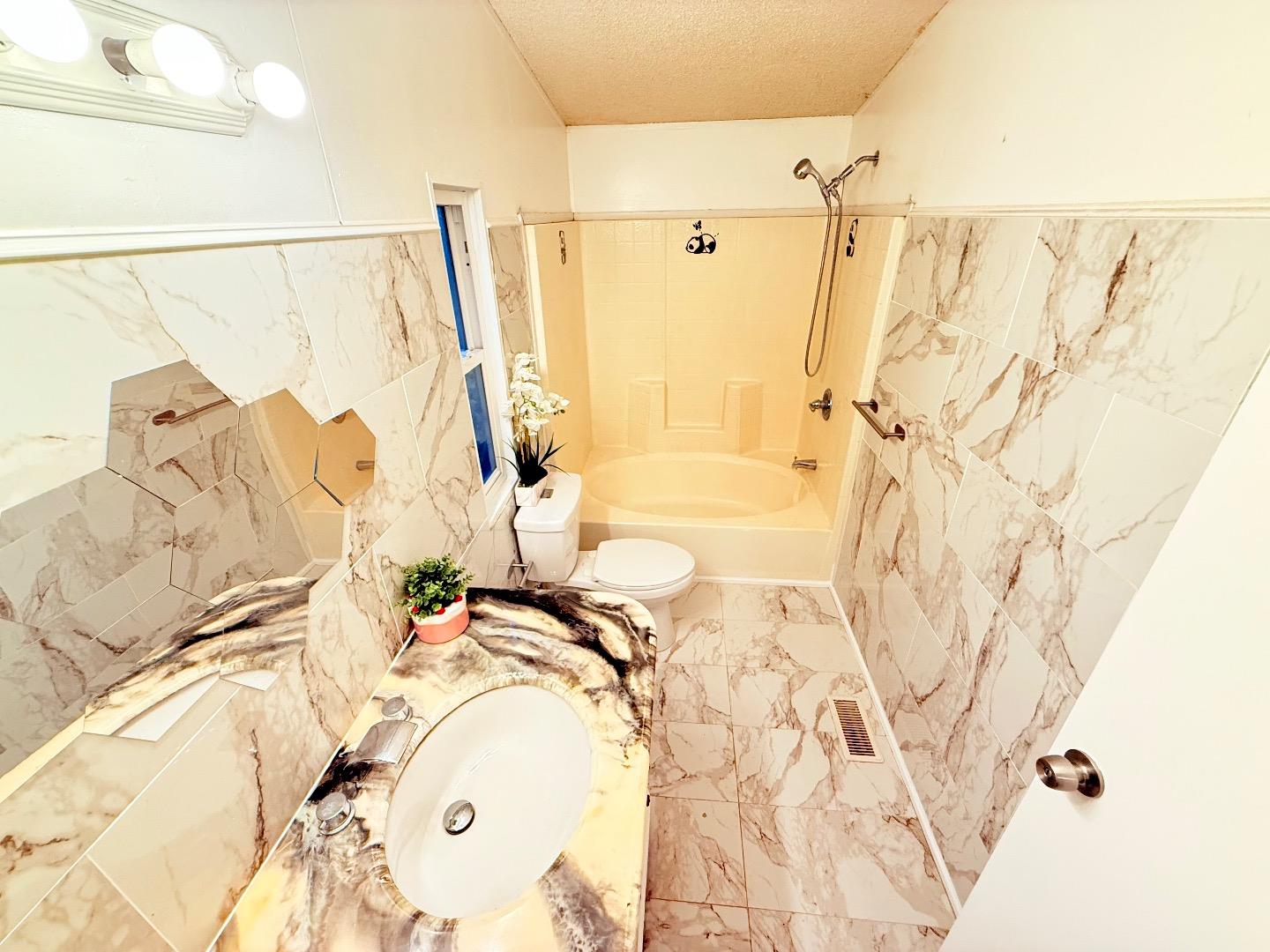 411 Lewis Road, Unit 335 San Jose, CA 95111 - Photo 25 of 27 a bathroom with a bathtub and shower