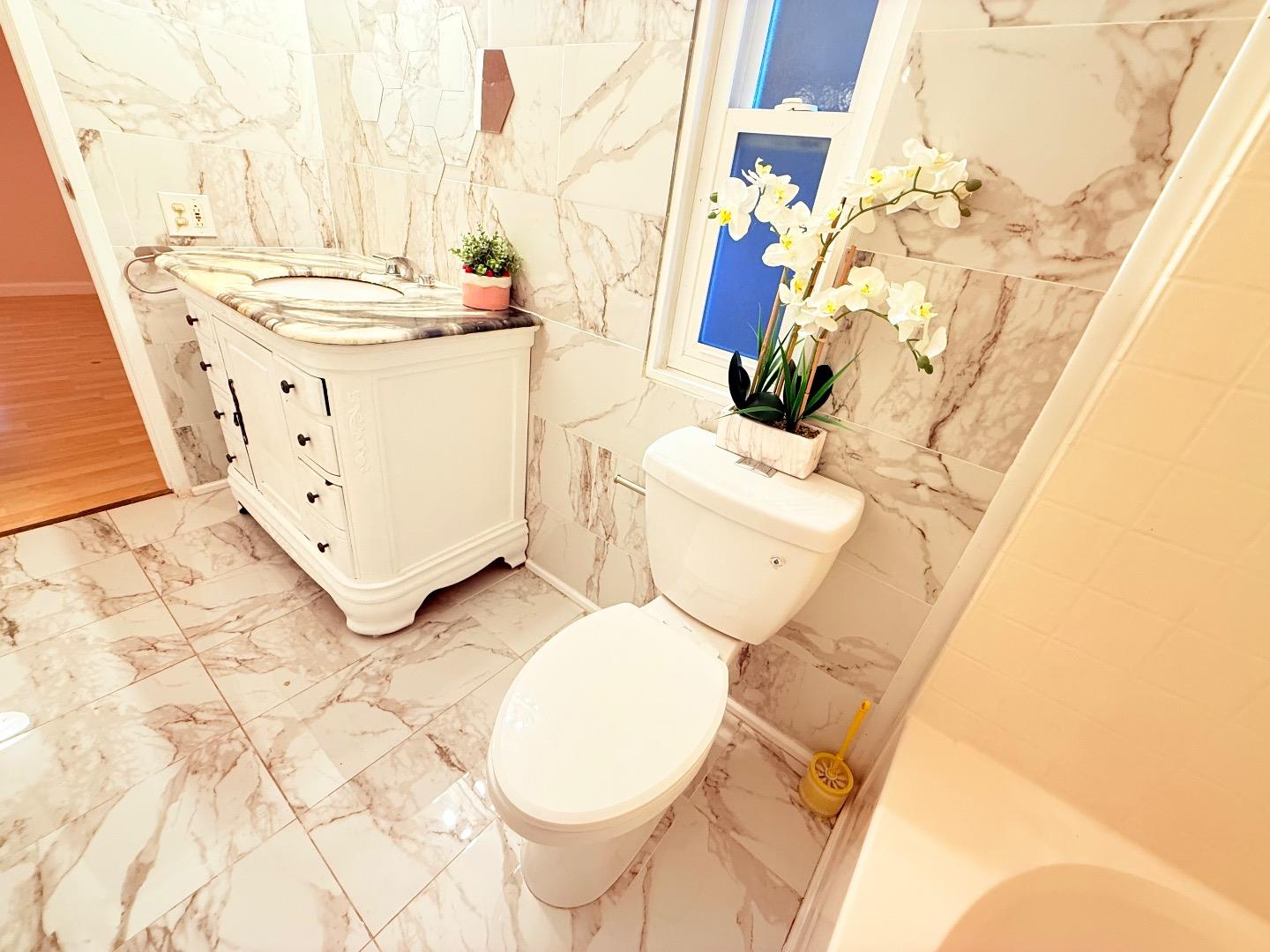 411 Lewis Road, Unit 335 San Jose, CA 95111 - Photo 26 of 27 a bathroom with a sink a toilet and mirror