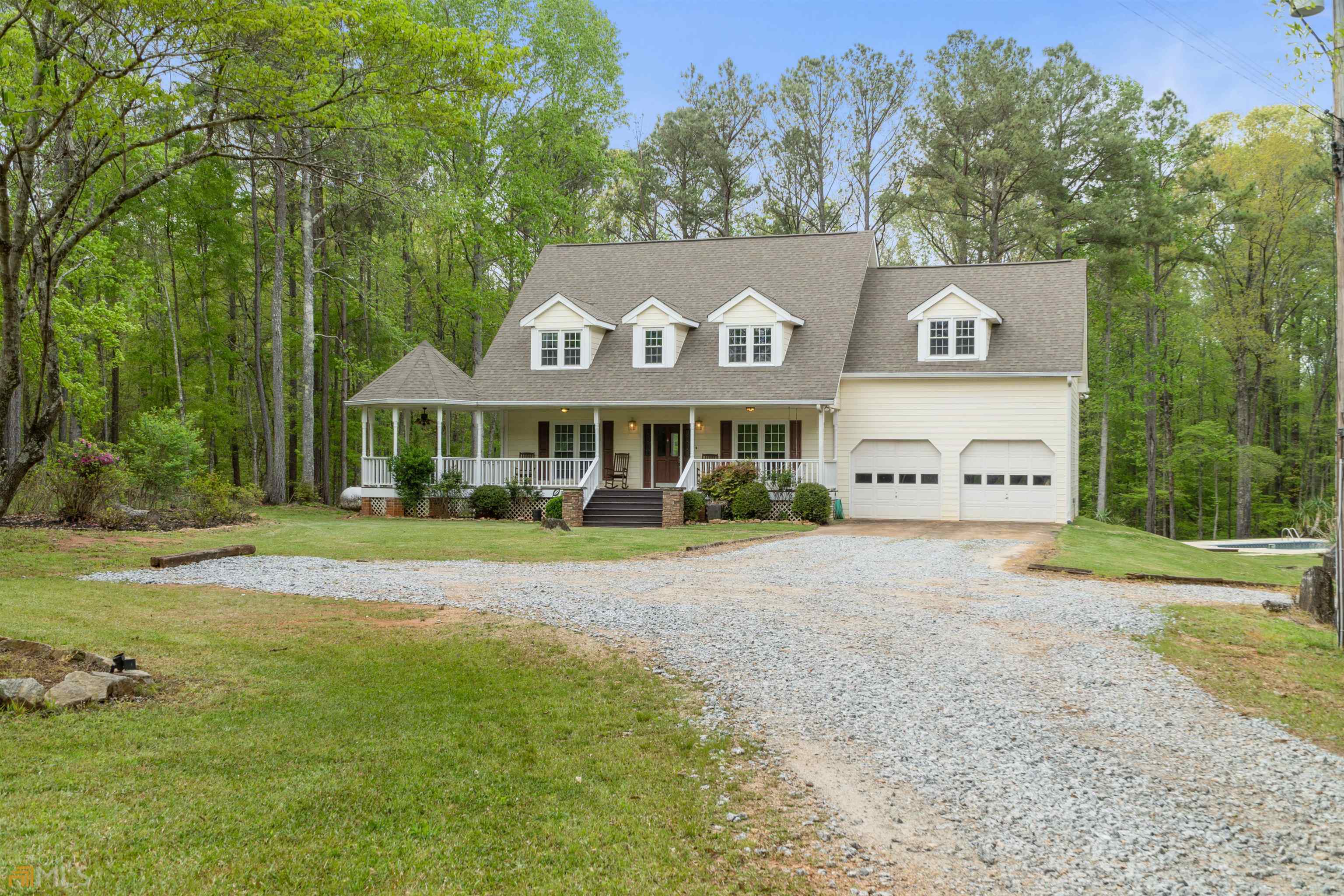 150 Allgood Road Newnan, GA 30263 - Photo 1 of 1 a front view of a house with garden