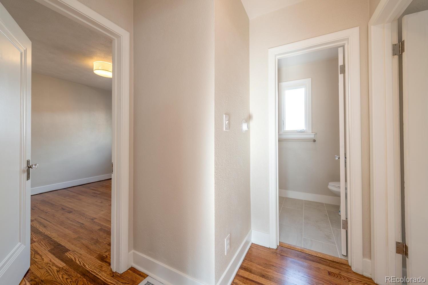 3527 Monroe Street Denver, CO 80205 - Photo 16 of 29 a view of a bathroom from a corridor