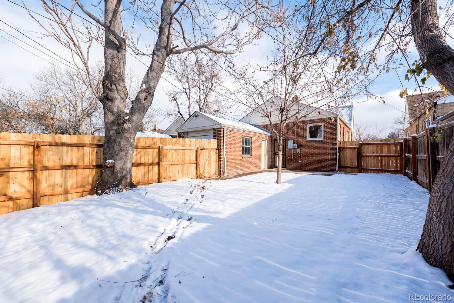 3527 Monroe Street Denver, CO 80205 - Photo 3 of 29 a view of backyard with large trees